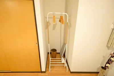 a stairway leading to a hallway with a ladder leading to a door at YUZU HOUSE in Tokyo