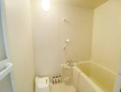 a bathroom with a toilet and a sink and a tub at Tsunoya in Tokyo