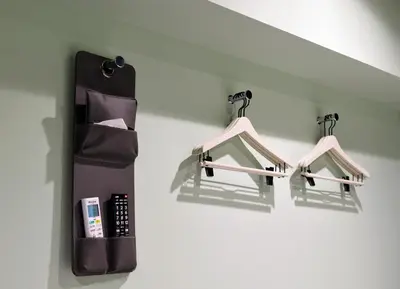a bathroom with two hangers on a wall at HOTEL TAVINOS ASAKUSA - Vacation STAY 64893 in Tokyo