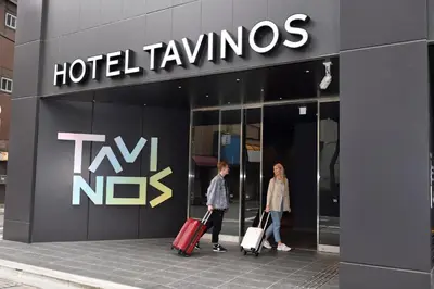 two people walking in front of a hotel tlv nhs at HOTEL TAVINOS ASAKUSA - Vacation STAY 64893 in Tokyo