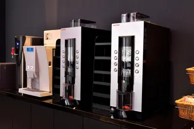 a group of three coffee machines on a counter at HOTEL TAVINOS ASAKUSA - Vacation STAY 64893 in Tokyo