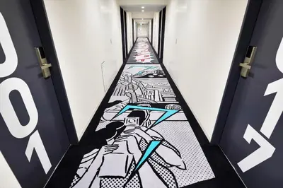 a hallway with a drawing on the door at HOTEL TAVINOS ASAKUSA - Vacation STAY 64889 in Tokyo
