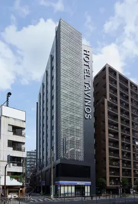 a tall building with a sign on the front of it at HOTEL TAVINOS ASAKUSA - Vacation STAY 64889 in Tokyo