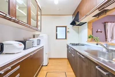 a kitchen with a sink and a refrigerator at Comfy Home Koiwa in Tokyo