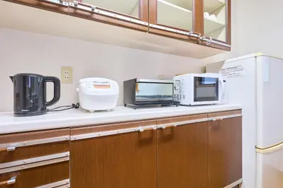 a kitchen with a counter with appliances on it at Comfy Home Koiwa in Tokyo