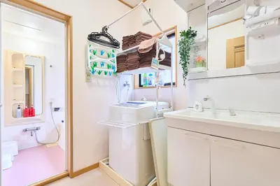 a bathroom with a sink and a toilet at Comfy Home Koiwa in Tokyo