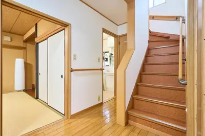 a hallway with stairs in a house at Comfy Home Koiwa in Tokyo