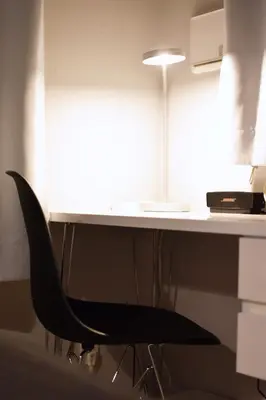 a desk with a black chair under a desk at Tune Inn Ebisu #1 in Tokyo
