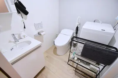 a bathroom with a toilet and a sink at Tune Inn Ebisu #1 in Tokyo