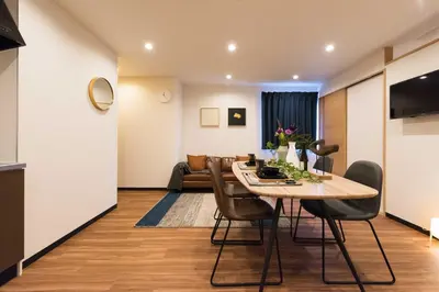a dining room with a table and chairs at TORA HOTEL Tokyo Skytree \u5bc5\u30db\u30c6\u30eb \u30b9\u30ab\u30a4\u30c4\u30ea\u30fcF in Tokyo