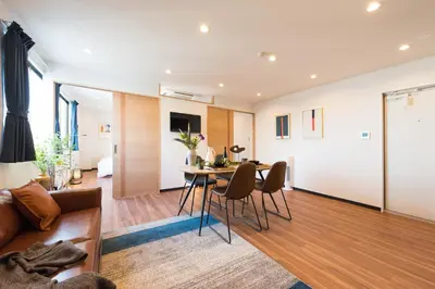 a living room with a couch and a table at TORA HOTEL Tokyo Skytree \u5bc5\u30db\u30c6\u30eb \u30b9\u30ab\u30a4\u30c4\u30ea\u30fcF in Tokyo