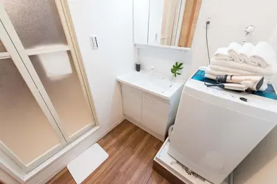a small bathroom with a sink and a toilet at TORA HOTEL Tokyo Skytree \u5bc5\u30db\u30c6\u30eb \u30b9\u30ab\u30a4\u30c4\u30ea\u30fcF in Tokyo