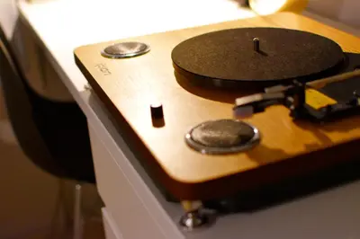 a wooden table with a gun on top of it at Tune Inn Ebisu in Tokyo