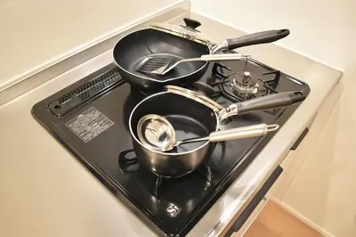 a bunch of pots and pans sitting on a stove at FINOA Residential Suite Asakusa/Oshiage Skytree in Tokyo