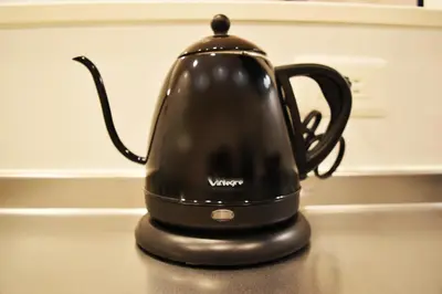 a black tea kettle sitting on top of a counter at FINOA Residential Suite Asakusa/Oshiage Skytree in Tokyo