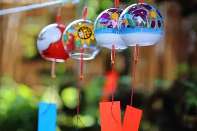 a group of glass ornaments hanging from a string at Stay SAKURA Tokyo Asakusa Edo no Mai in Tokyo