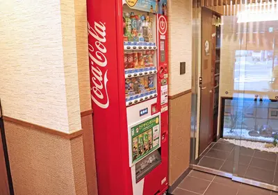 a coca cola vending machine in a store at Stay SAKURA Tokyo Asakusa Edo no Mai in Tokyo