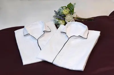 two white shirts and a bouquet of flowers at Stay SAKURA Tokyo Asakusa Edo no Mai in Tokyo