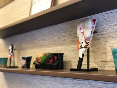 a shelf with a picture of a woman on it at Stay SAKURA Tokyo Asakusa Edo no Mai in Tokyo