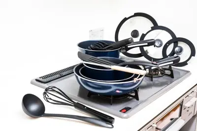a pile of dishes and utensils on a tray at Yahiro 4-chome House 1F in Tokyo