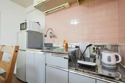 a kitchen with a sink and a counter at Sun white Gyoutoku 303 in Tokyo