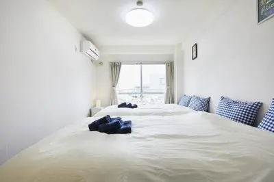 a large white bed in a room with a window at Sun white Gyoutoku 202 in Urayasu