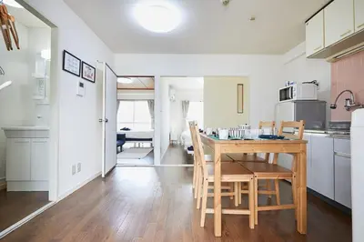 a kitchen and dining room with a table and chairs at Sun white Gyoutoku 202 in Urayasu