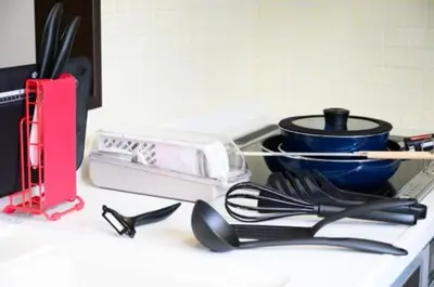 a kitchen counter with a toaster and utensils at Yahiro 4-chome House 2F,3F in Tokyo
