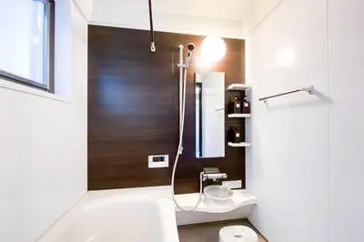 a bathroom with a shower and a toilet and a sink at Yahiro 4-chome House 2F,3F in Tokyo