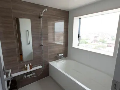 a bathroom with a bath tub and a window at Asakusa Tobu Hotel in Tokyo