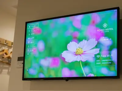 a flat screen tv with a flower on it at Tosei Hotel Cocone Asakusa Kuramae in Tokyo