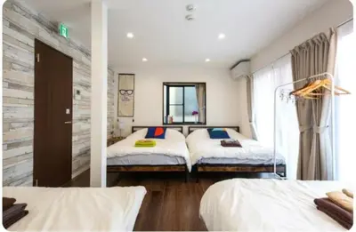 a bedroom with two beds and a window at Arakawa-ku - House / Vacation STAY 66906 in Tokyo