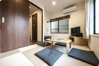 a living room with a table and a television at Arakawa-ku - House / Vacation STAY 66906 in Tokyo