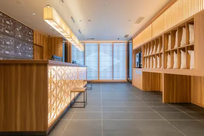 a tasting room with wooden cabinets and a tile floor at Tosei Hotel Cocone Ueno Okachimachi in Tokyo