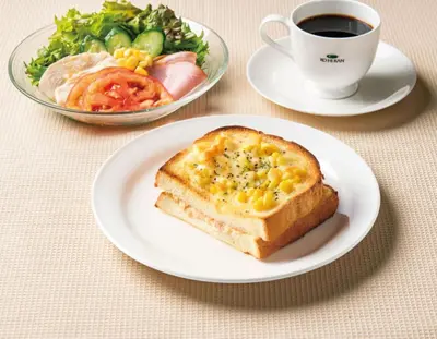 a white plate with a sandwich and a cup of coffee at Tosei Hotel Cocone Ueno Okachimachi in Tokyo