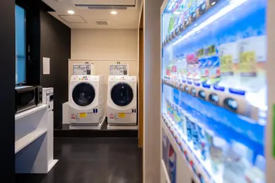 a row of washing machines in a store at Tosei Hotel Cocone Ueno Okachimachi in Tokyo