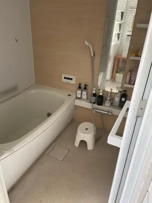 a bathroom with a bath tub and a shower at Hostel 1010 TOKYO in Tokyo