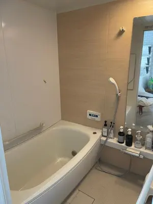 a white bath tub in a bathroom with a shower at Hostel 1010 TOKYO in Tokyo