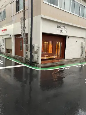 a street with a hospital sign in front of a building at Hostel 1010 TOKYO in Tokyo