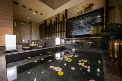 a hotel lobby with a pool in the middle of it at HOTEL VARKIN ANNEX in Tokyo