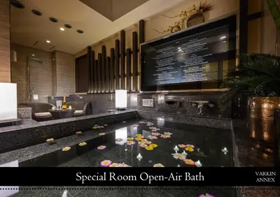 a hotel room with a swimming pool with flowers in it at HOTEL VARKIN ANNEX in Tokyo