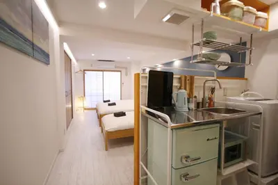 a small kitchen with a sink and a counter at STAY ARI Kabukicho in Tokyo
