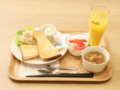 a tray with a plate of food with a sandwich and a drink at Smart Stay SHIZUKU Ueno Ekimae in Tokyo
