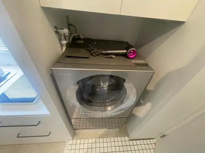 an overhead view of a washing machine in a bathroom at GalleryInn Fuji, Shibuya in Tokyo