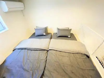 a bedroom with two beds in a room at Shibuya Stay Tokyo B103 in Tokyo