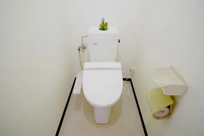 a bathroom with a white toilet in a room at nestay suite tokyo tabata 03 in Tokyo
