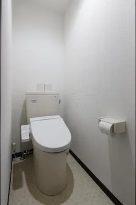 a bathroom with a white toilet in a stall at G&R House 101 in Tokyo