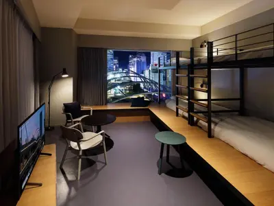 a hotel room with a bunk bed and a tv at sequence MIYASHITA PARK - Shibuya in Tokyo