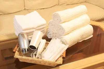 a basket with towels and other items on a table at RKT4bedroom ForFamily 30mins Shibuya and Azabu in Tokyo