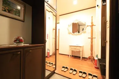 a hallway with a mirror and a room with shoes at RKT4bedroom ForFamily 30mins Shibuya and Azabu in Tokyo